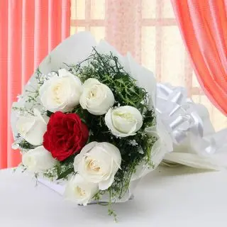 7 white roses with 1 red rose in centre