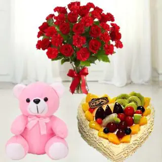 Vase Arrangement of 20 red roses with red carnations , mix fruit heart shape cake with 6 inch teddybear 
