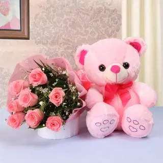 8 pink roses with a cute pink teddy bear of 1 feet height 