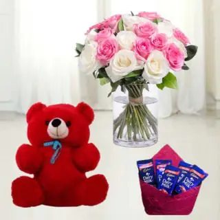 Pink and white roses in glass vase with 6 inch red teddy bear & pack of 5 dairy milk chocolate