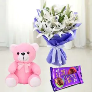  Bunch of 8 white lilies with set of 2 dairy milk chocolates with 6 inch teddybear 