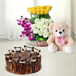 Basket arrangement of 25 roses with 5 orchids with teddybear along with irish chocolate cake 