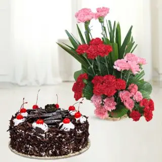 Basket arrangement of 30 red and pink carnation with black forest cake 