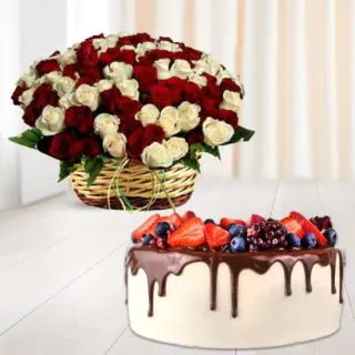 Basket arrangement of 50 red and white roses with chocolate strawberry cake 
