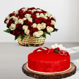 Basket arrangement of 50 red and white roses with half kg red velvet cake 