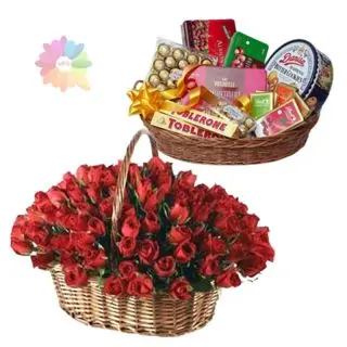 Basket arrangement of 60 red roses with Premium chocolate hamper of rich delicious chocolates