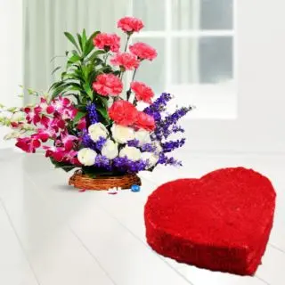 Basket Arrangement of carnations, roses and orchids with heart shape red velvet cake 
