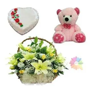 Basket arrangement of exotic lilies with fresh roses with heart shape vanilla fresh cream cake with 2 feet height teddy bear