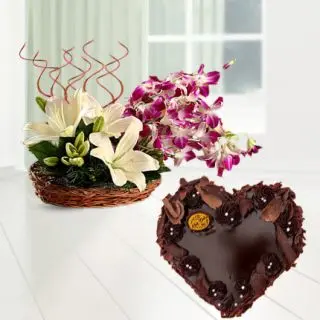 Basket Arrangement of lavender orchids with white lilies with heart shape chocolate cake 