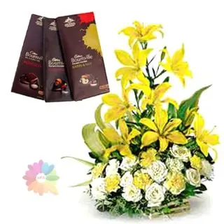Basket arrangement of lilies&roses with 3 bournville chocolates