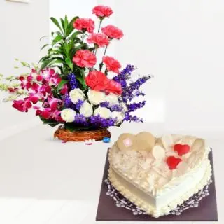 Basket arrangement of orchids carnations roses with white forest heart shape cake 
