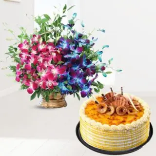 Basket arrangement of purple and blue orchids with honey cool cake 