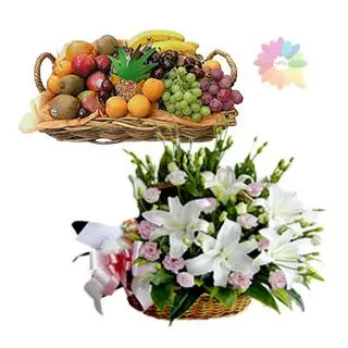 Basket arrangement of white lilies with pink roses with 5 kg mix fruit basket