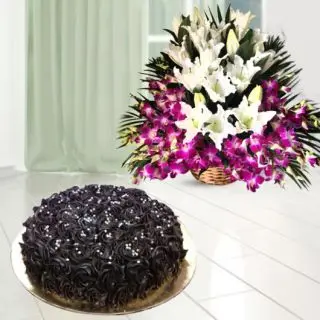 Basket Arrangement of white lilies with purple orchids with chocolate cool cake 