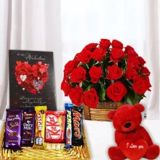 basket of 15 red roses, 6 inch height red teddybear, greeting card, basket of assorted chocolates 