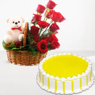 Basket of 15 red roses with teddy bear sitting in it with pineapple cake 