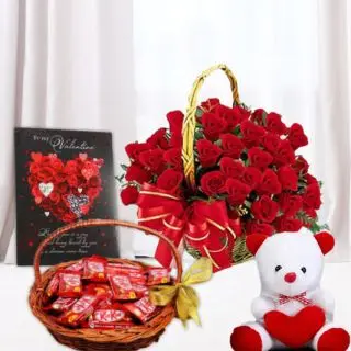 Basket of 20 red roses, valentine day greeting card, 6 inch white teddybear, basket of kitkat chocolates 