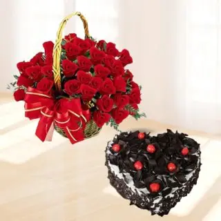 Basket of 20 red roses with 1 kg heart shape black forest cake 