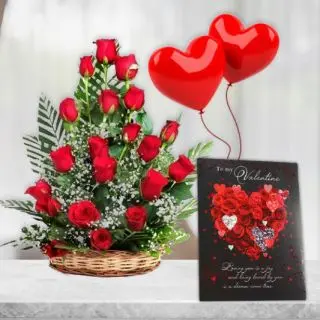 Basket of 20 red roses with valentine day greeting card with pair of heart shape balloons 