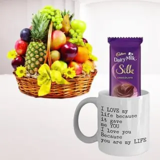 Basket of 3 kg assorted fruits with dairy milk silk arranged in photo mug 