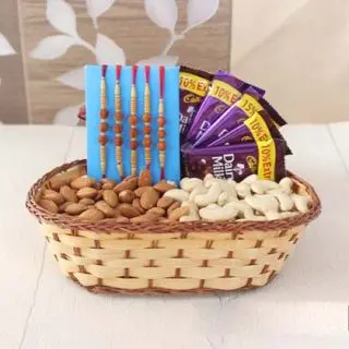 Basket of 5 dairy milk, with set of 5 rakhi, with 200 grams cashew and almond 
