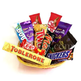 Basket of  assorted chocolates including 2 dairy milk silk, 1 toblerone, 1 snickers, 1 twix,1 mars, 1 bounty, 3 kitkat ,1 bournville  