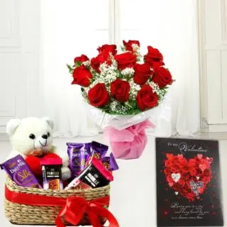 Basket of assorted chocolates with teddybear sitting in it, bunch of 10 red roses, valentine day card 