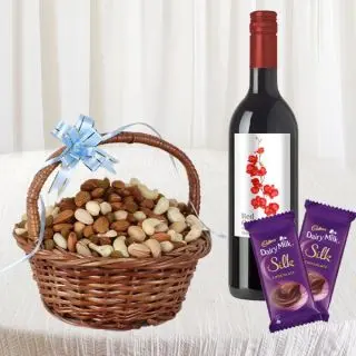 Basket of half kg assorted nuts, bottle of red wine, 2 silk chocolates 