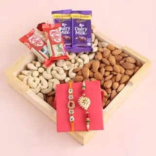 Basket of half kg cashew almond basket , set of 2 rakhis, with 4 assorted chocolates 