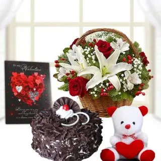 Basket of red roses with lilies, 6 inch white teddybear, half kg black forest cake, valentine greeting card 