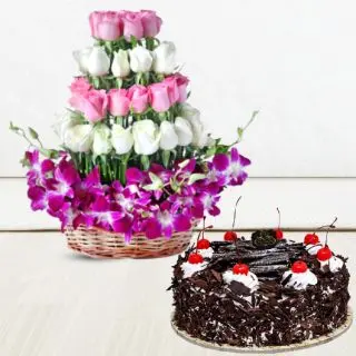 Beautiful Basket arrangement of 10 purple orchids with 25 pink and white roses with premium quality Black forest   cake 