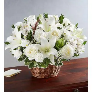 Basket Arrangement of white lilies with white roses