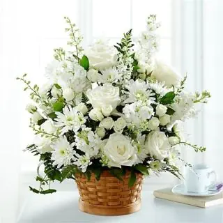 Beautiful Basket of white mix flowers including roses, daisies , orchids  