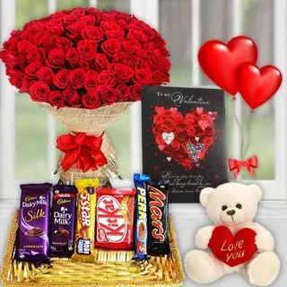 Beautiful Big Bunch of 50 romantic red roses, valentine day greeting card, basket of assorted chocolates, 1 feet height teddybear with pair of heart shape balloons 