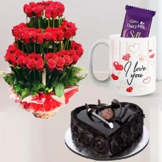 Beautiful designer arrangement of 100 red roses, 1 kg heart shape chocolate truffle cake, photo mug with cadbury silk 