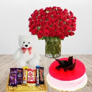 Beautiful vase arrangement of 100 red roses, strawberry cool cake, 6 inch white teddy bear with basket of assorted chocolates 