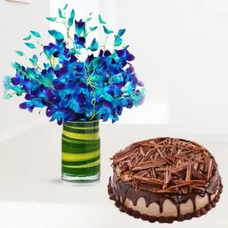 Beautiful vase arrangement of 10 blue orchids with chocolate cheese cake 