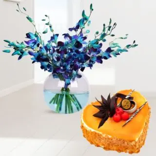 Beautiful vase arrangement of 10 blue orchids with heart shape mango cool cake 