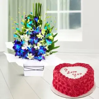Beautiful Vase Arrangement of blue and white orchids with heart shape red velvet cake 