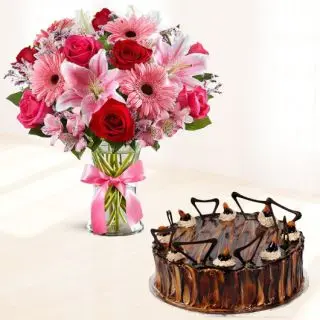 Beautiful Vase Arrangement of Gerberas, lilies, roses with irish chocolate cake 