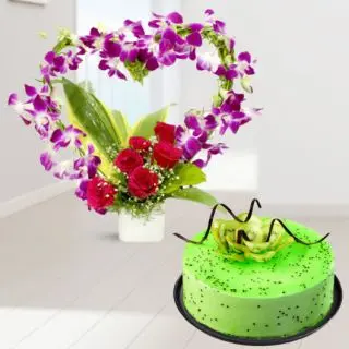 Beautiful vase arrangement of lavender orchids with red roses with kiwi cool cake 