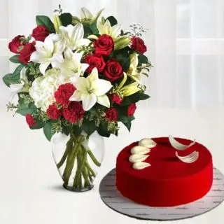 Beautiful vase arrangement of lilies, roses, carnations with red velvet premium quality cake 