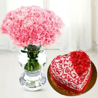 Beautiful vase arrangement of pink carnations with heart shape red velvet designer floral theme cake