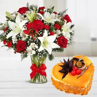 beautiful vase arrangement of red roses with white lilies with 1 kg mango cool cake 