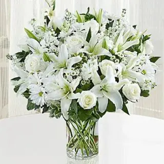 Beautiful vase arrangement of white exotic flowers 