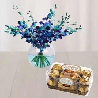Blue orchids in glass vase with box of 16 pcs rocher ferrero chocolates 