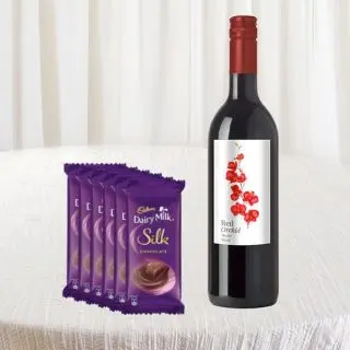 Bottle of red wine with 6 dairy milk silk chocolates 