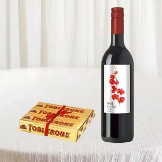 Bottle of red wine with set of 3 toblerone chocolates 