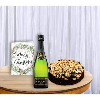 Bottle of wine , cashew plum cake , christmas greeting card