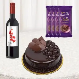 Bottle of wine, half kg chocolate premium quality cake, set of 4 dairy milk silk chocolates 
